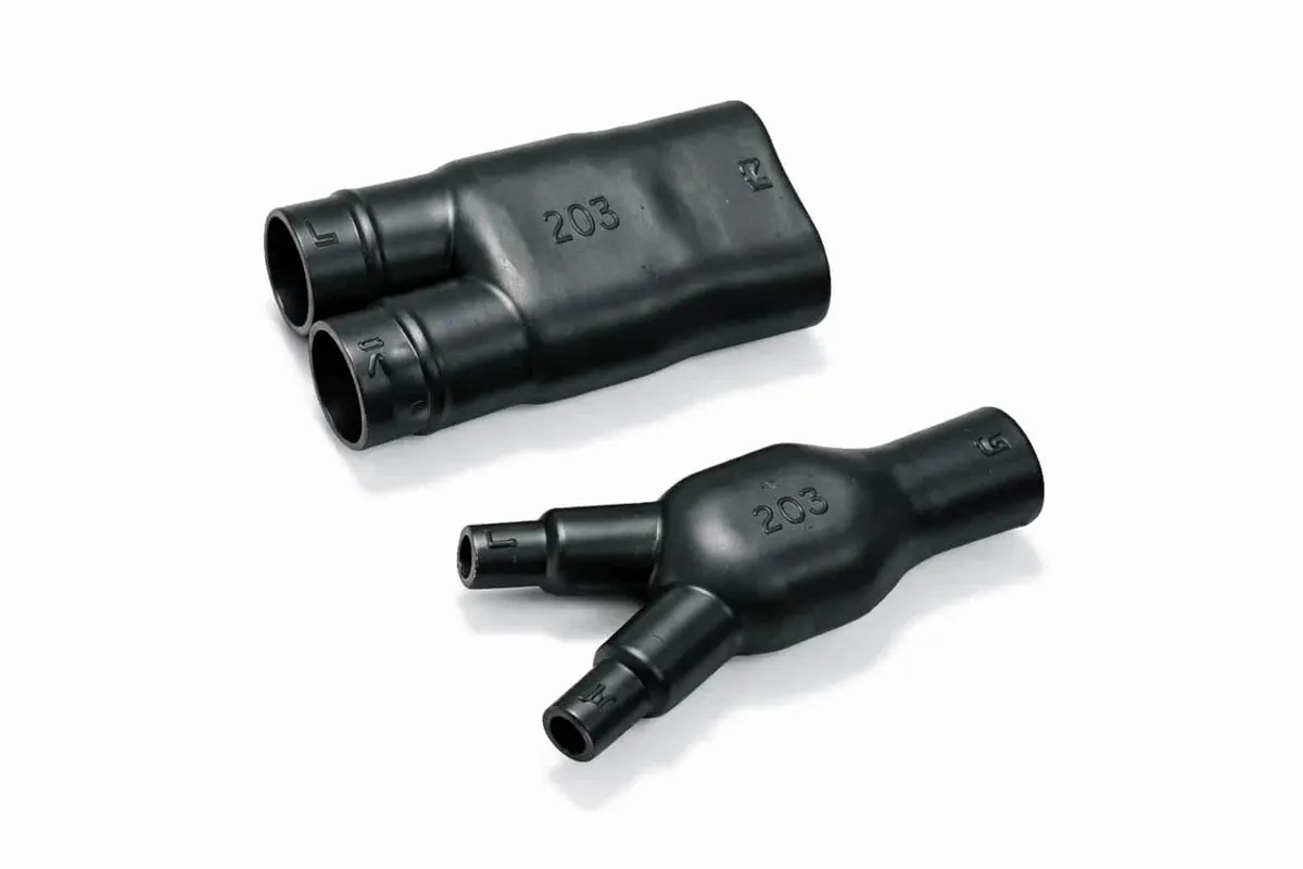 Helashrink 200 series two way outlet heat shrink molded shape providing mechanical tension relief in cable harnesses